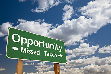 Image showing Opportunity Missed and Taken Green Road Sign and Clouds