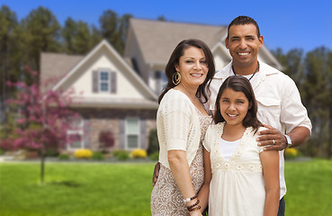 Image showing Small Hispanic Family in Front of Their Home