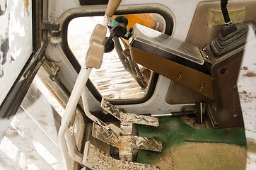 Image showing inside tractor cabin device gears handles pedals 