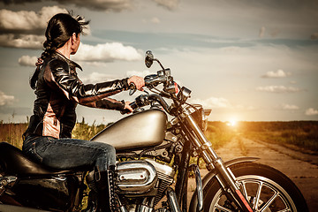 Image showing Biker girl on a motorcycle