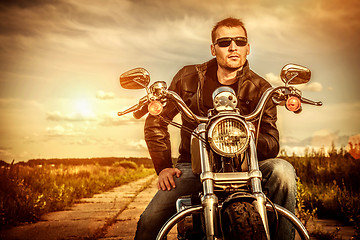 Image showing Biker on a motorcycle