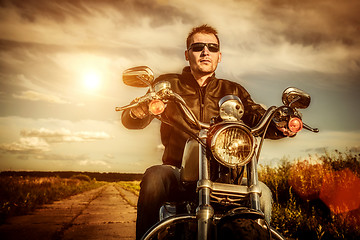 Image showing Biker on a motorcycle