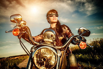 Image showing Biker girl on a motorcycle