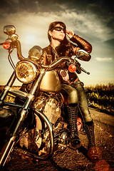 Image showing Biker girl on a motorcycle