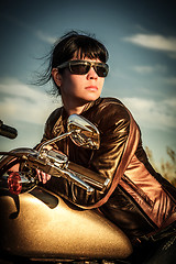 Image showing Biker girl on a motorcycle