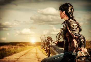 Image showing Biker girl on a motorcycle