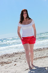 Image showing Attractive woman in shorts on the beach