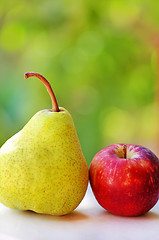 Image showing Ripe pear and red apple