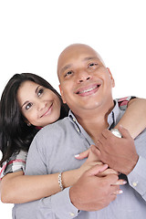 Image showing Thoughtful couple hugging and looking up - isolated over white. 