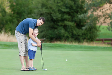 Image showing family at golf course