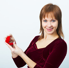 Image showing young attractive woman with a box for rings