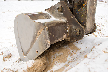 Image showing excavator bucket close sand pit quarry snow winter 