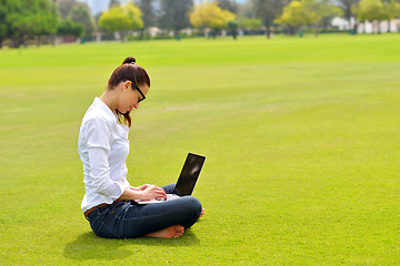 Image showing woman with laptop in park