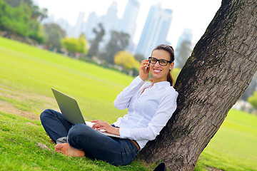 Image showing woman with laptop in park