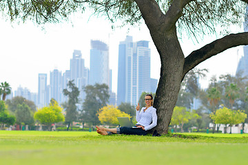 Image showing woman with laptop in park