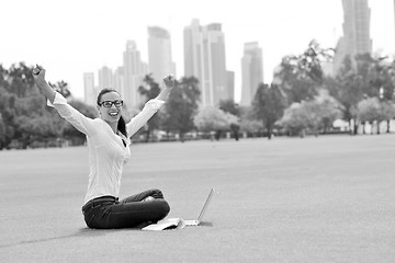 Image showing woman with laptop in park