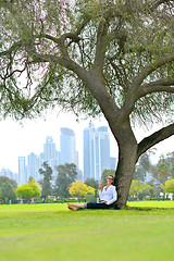 Image showing woman with laptop in park