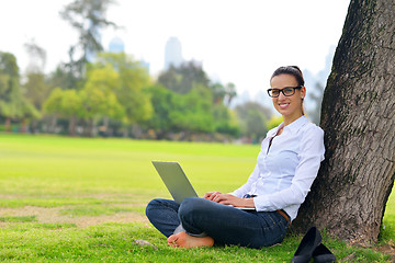 Image showing woman with laptop in park