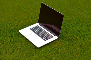 Image showing laptop computer  on grass