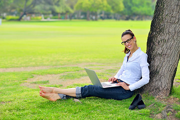 Image showing woman with laptop in park