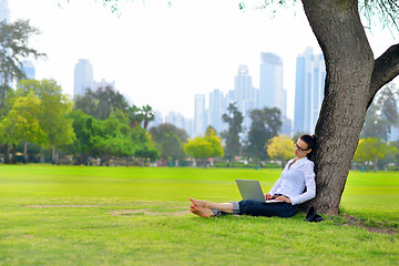 Image showing woman with laptop in park