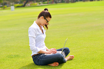 Image showing woman with laptop in park