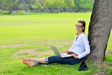 Image showing woman with laptop in park