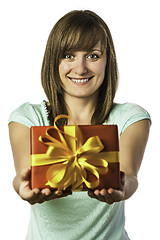 Image showing Happy young girl holding present