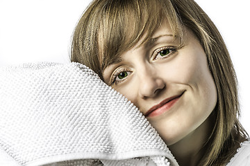 Image showing Young girl snuggled in towel