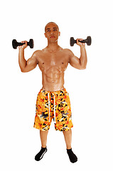 Image showing Guy holding dumbbell.