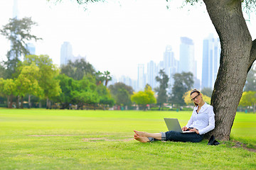 Image showing woman with laptop in park