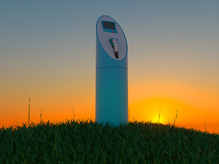 Image showing Charging station in the green field at dawn