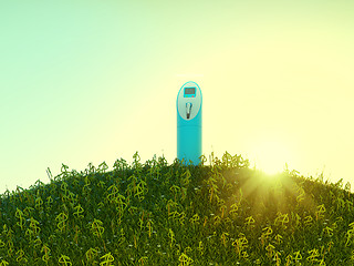 Image showing Charging station on meadow with USD shaped grass