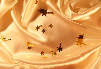 Image showing New year holiday golden silk as background 