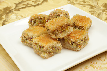 Image showing Kunafa stuffed with fruit and nuts