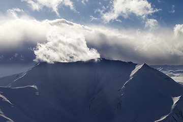 Image showing Mountains in evening and sunlight clouds