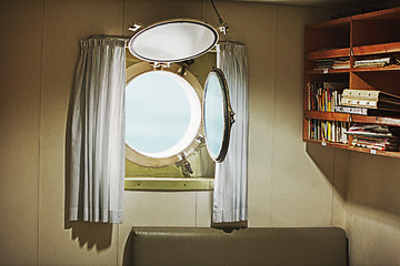 Image showing Porthole in the cabin of an old yacht