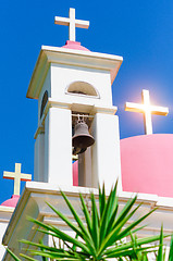 Image showing Sunshine ray reflection in golden crosses on pink domes
