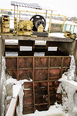 Image showing frozen river dam mechanism gate winter 