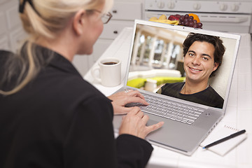 Image showing Woman In Kitchen Using Laptop Online Dating Search