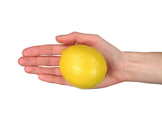 Image showing Woman’s hand offering a lemon (+ clipping path)