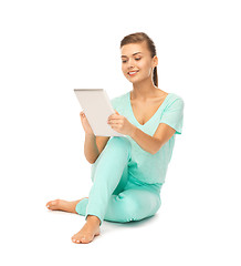 Image showing girl sitting on the floor with tablet pc