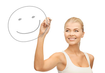 Image showing woman drawing happy face