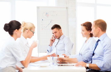 Image showing stressed male boss on business meeting