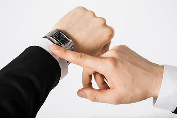 Image showing man looking at wristwatch