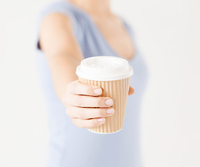 Image showing woman hand holding take away coffee cup