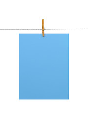 Image showing Sky-blue paper sheet on a clothes line (+2 clipping paths)