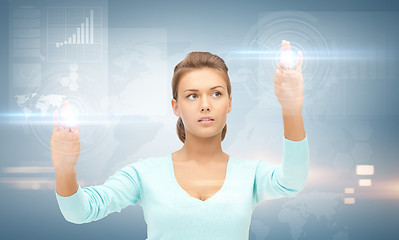 Image showing businesswoman working with something imaginary