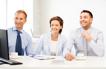 Image showing business team discussing something in office