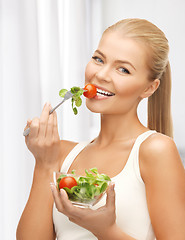 Image showing healthy woman holding bowl with salad